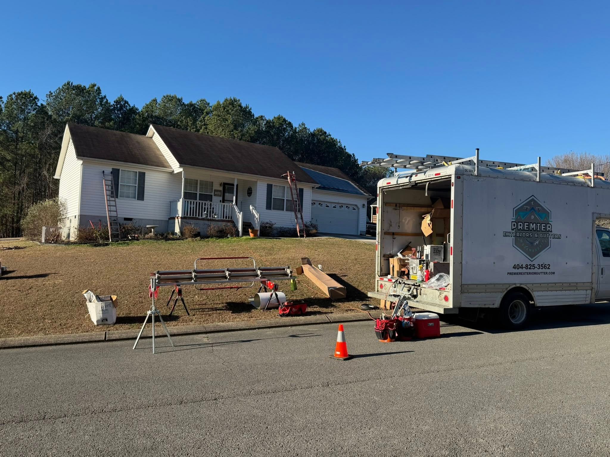 Premier Exteriors & Gutters truck on a Cohutta install day